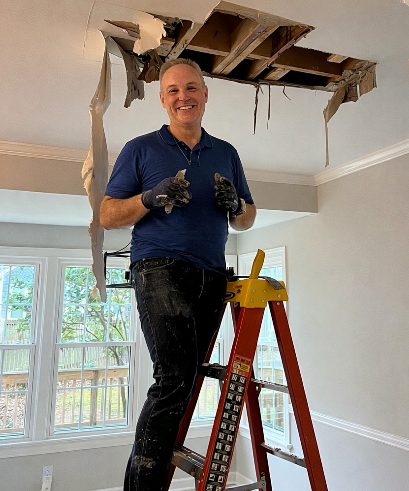 Mark Faust, owner of MCKS Handyman Services, LLC, working on a ceiling repair in Holly Springs NC